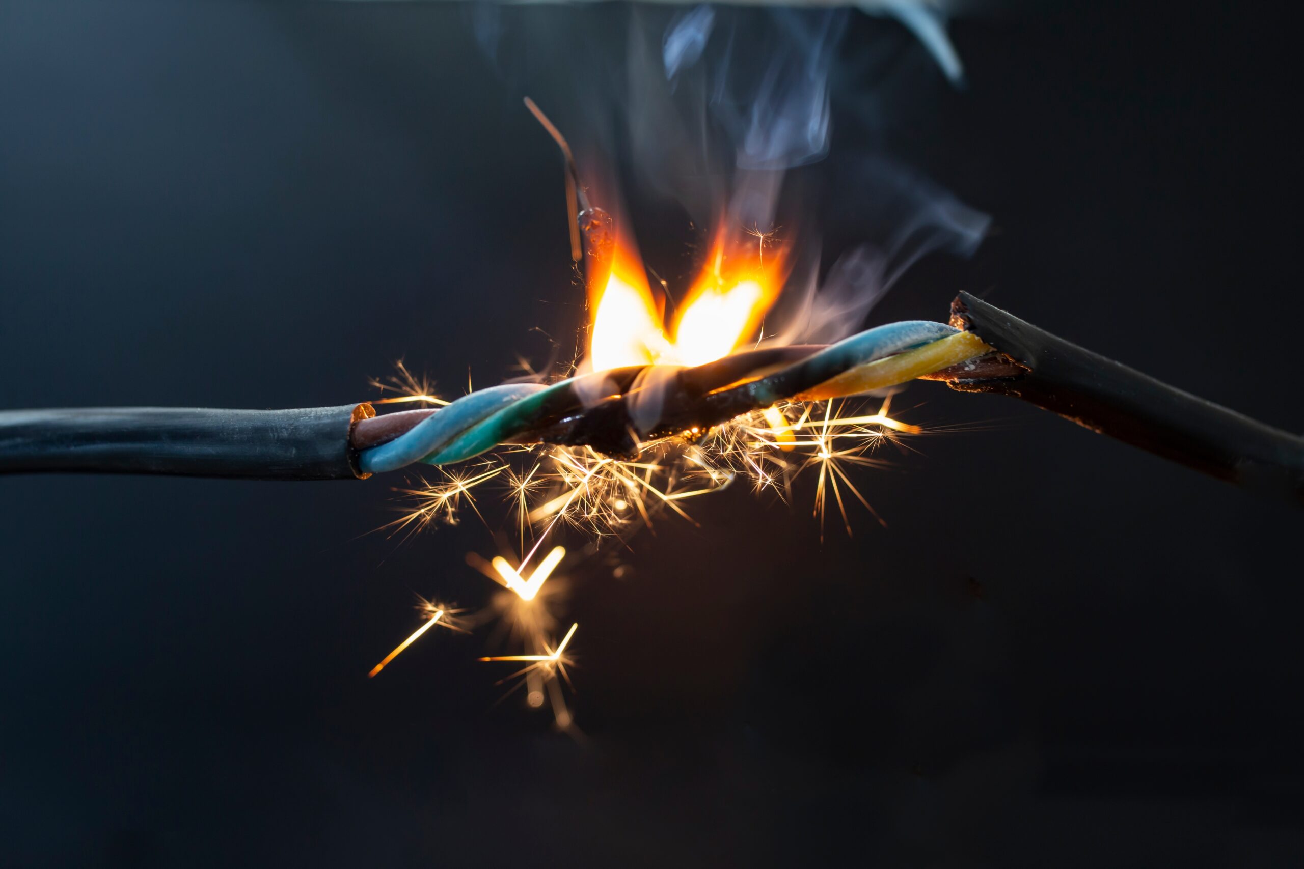 Flame,Smoke,And,Sparks,On,An,Electrical,Cable,,Fire,Hazard 2